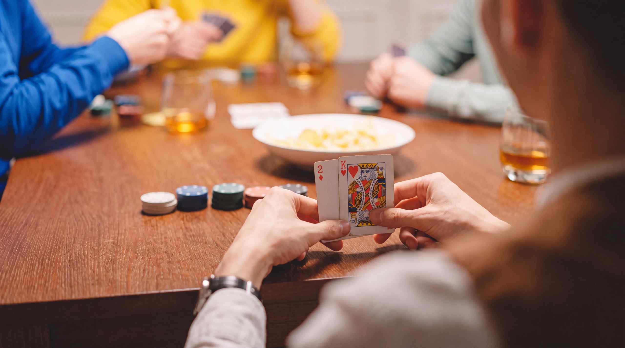 A poker game being held at home.